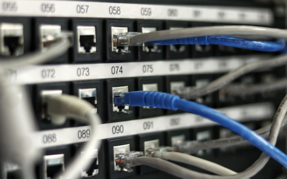 Ethernet cables connected to numbered network patch-panel ports